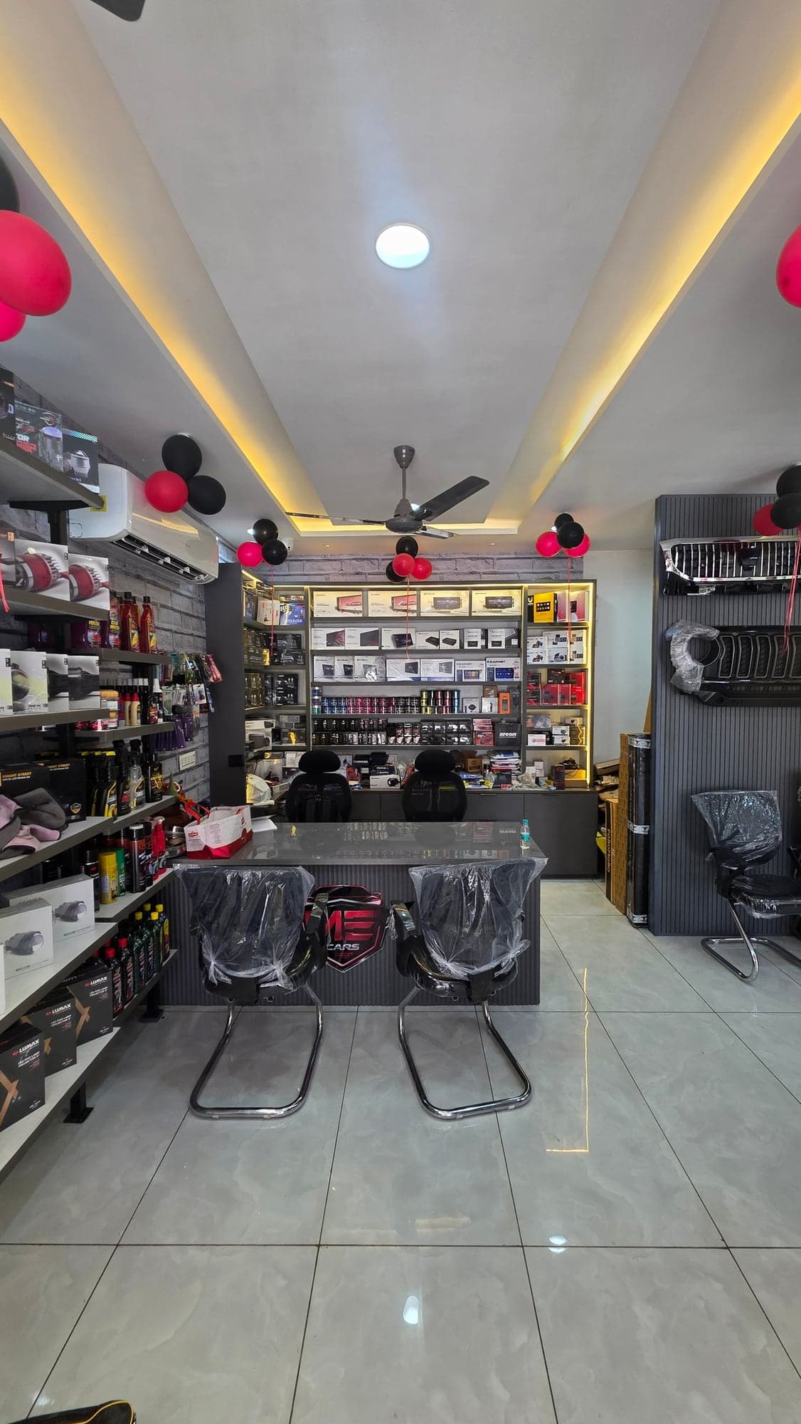 Cove ceiling with warm profile lighting over the Malik Electronics showroom floor, Dugri, Ludhiana