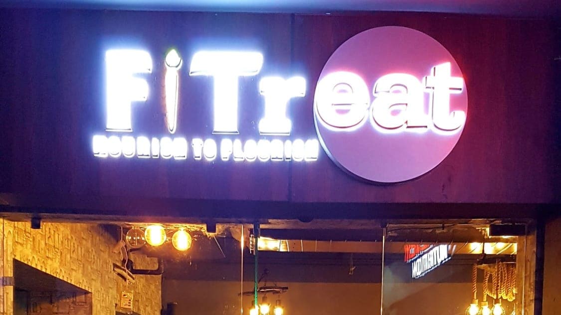 FiTreat – Nourish to Flourish illuminated restaurant signage on Pakhowal Road, Ludhiana