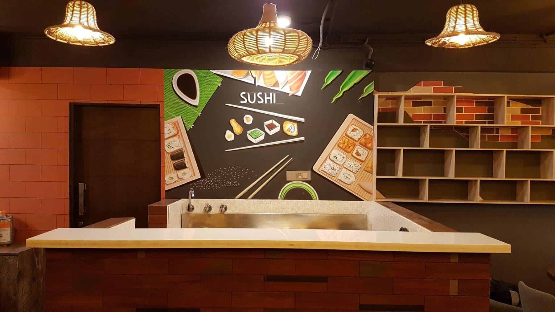 Minimalist sushi feature wall above the service counter with jute pendant lamps, FiTreat restaurant, Ludhiana